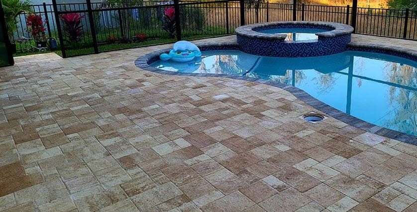 Patio and pool deck pavers after sealing in Crosswater